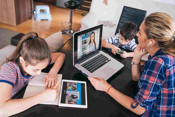 Family using virtual care with doctor on computer